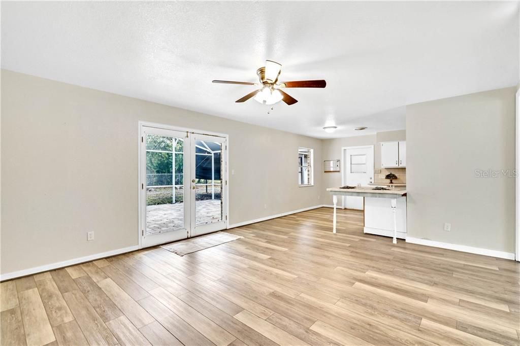 French doors lead you to screened paver patio