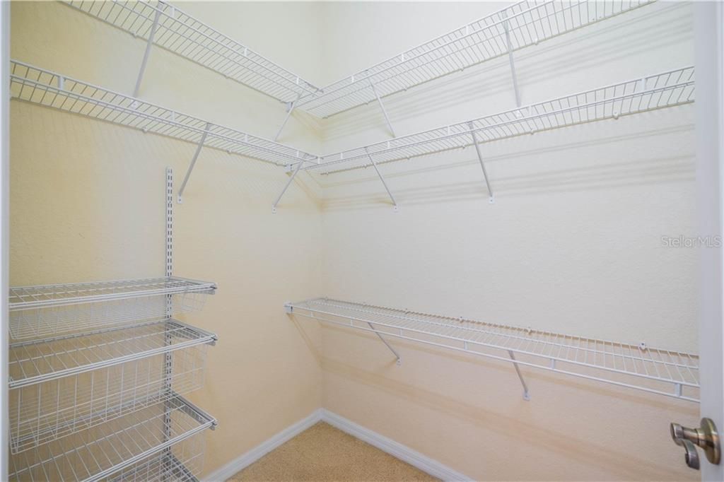 Master walk in Closet with special shelving and drawers. #1 closet, there is another regular closet across the hall