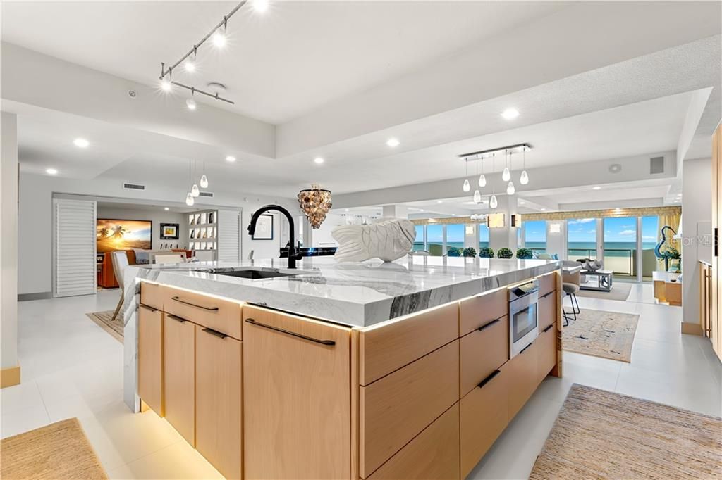 Undermount lighting perfectly highlights the beauty of the custom cabinetry.  Built-in appliances allows the kitchen to remain a beautiful, functional showpiece without clutter.