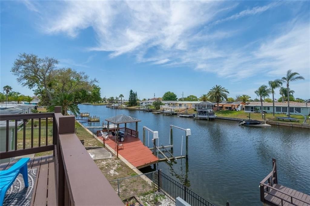Welcome home to this waterfront duplex at 12627 1st Isle!