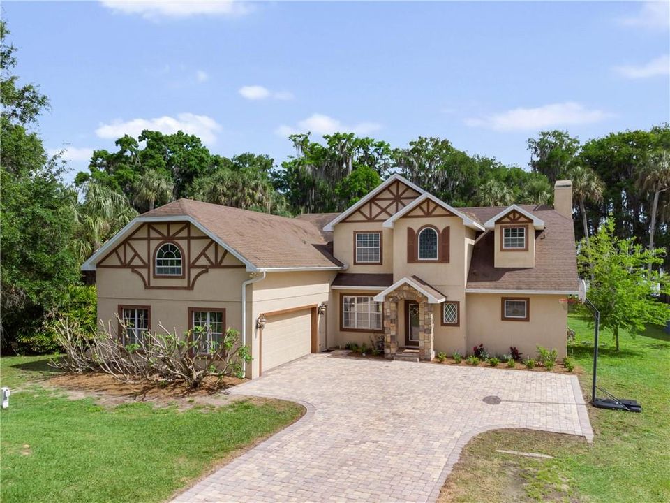 This Graceful Tudor features 4 Bedrooms & 3 Baths