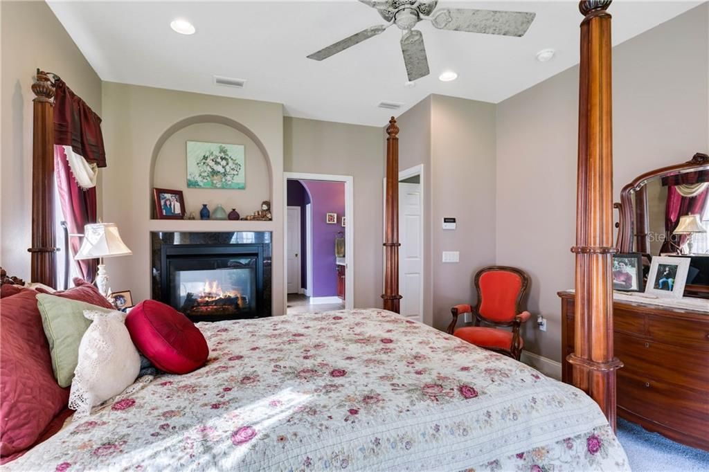 The Two Way Fireplace adds a romantic touch to the Master Bedroom Suite
