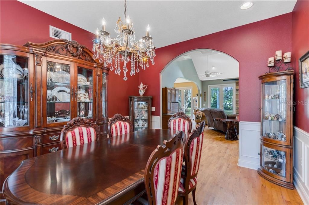 Formal Dining Room features Arched Entrance Ways