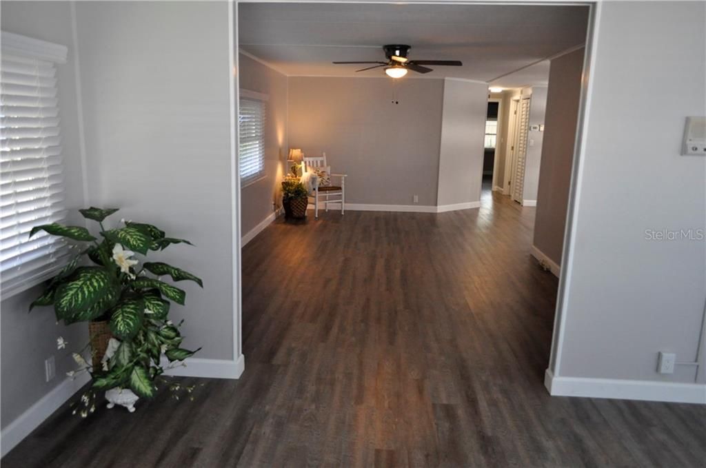 Living Room (New flooring, Paint, fixtures & Blinds)