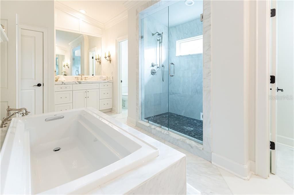 Stunning Master Bath Features Dual Sinks with Marble Countertops