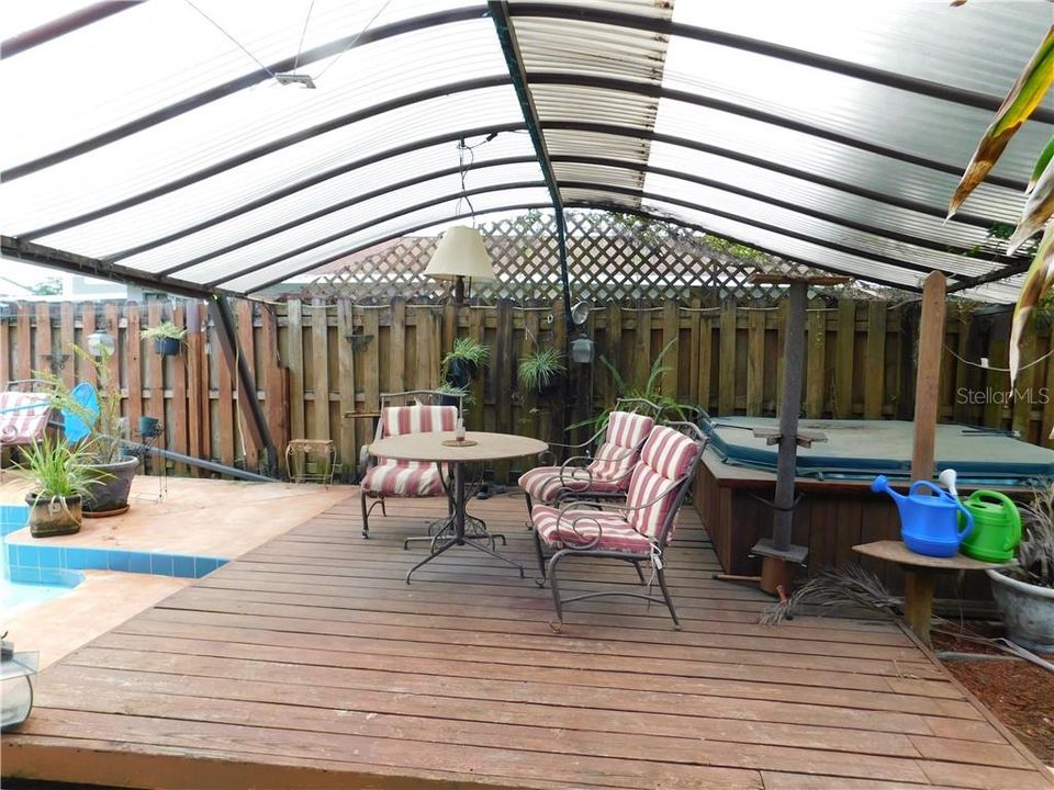 POOL Area view of covered raised wood deck