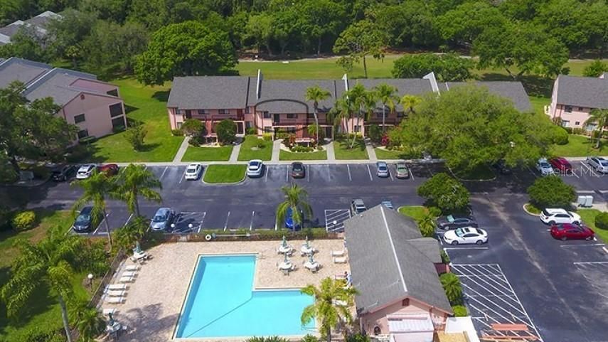 Front Elevation - Community Pool in front and Golf Course in the back.