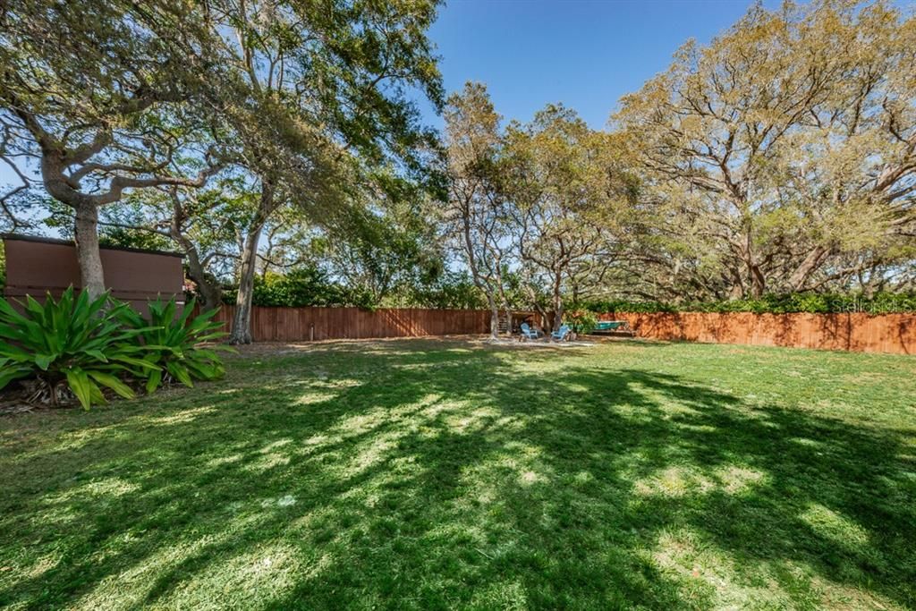 Family fun and great entertaining in this huge backyard.  Fully fenced with firepit and shed.