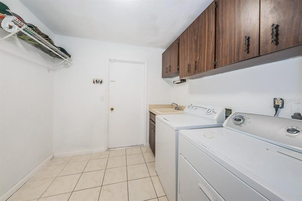Laundry room can accommodate a second fridge