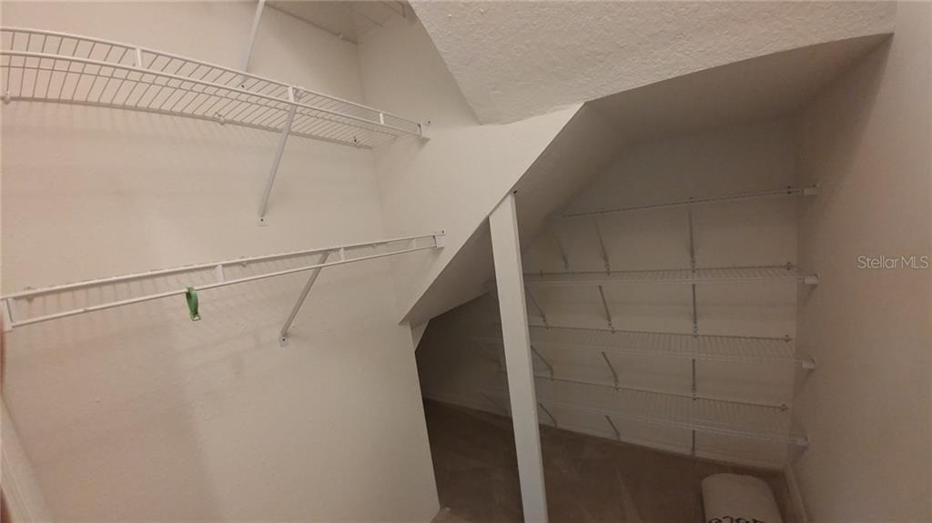 Tons of storage under stairs