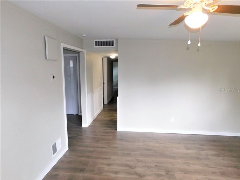 hallway to bedrooms, kitchen to the left
