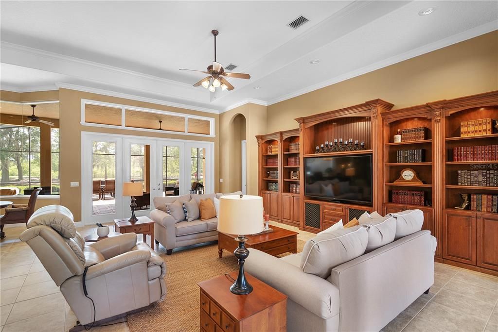 Family room features stunning entertainment center & 14' tray ceilings.