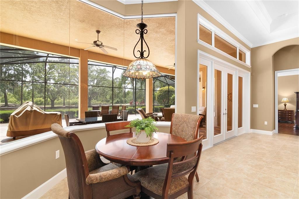 Breakfast nook features mitered glass windows for beautiful views.