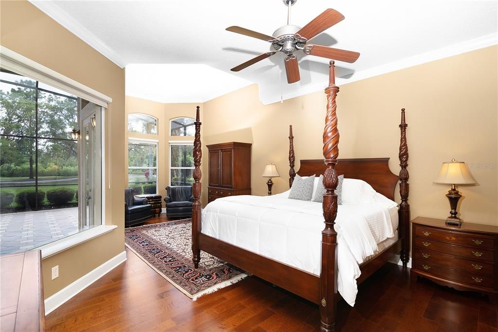 Master bedroom with majestic views and wood floors.