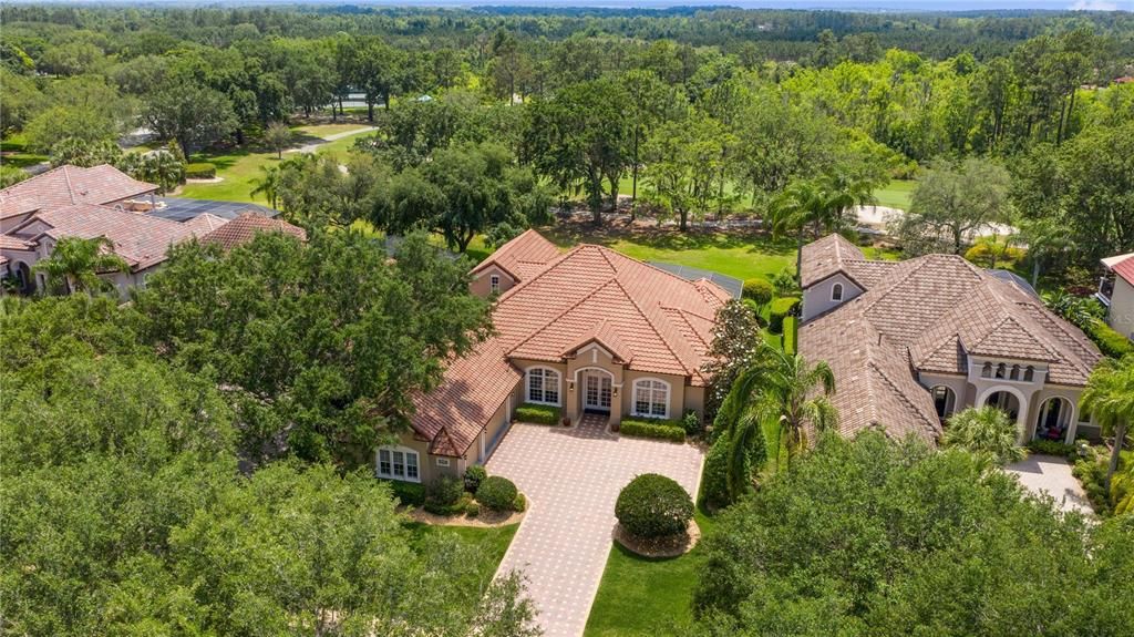 Lovely aerial front elevation view.  Within walking distance to the club house & tennis courts.