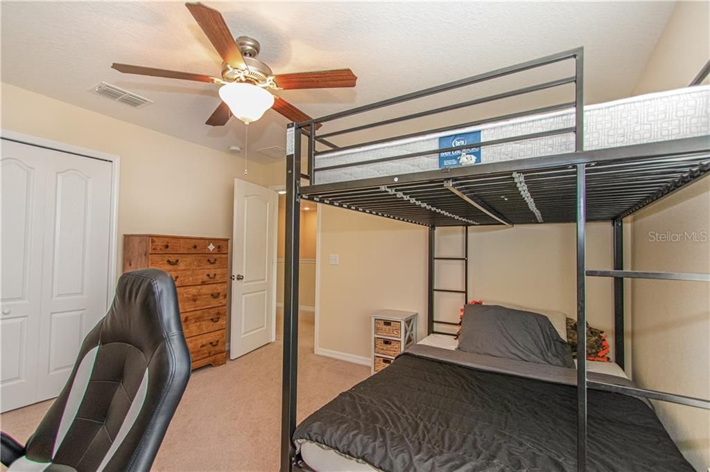 Bedroom 3 with large bunk beds, desk, and dresser!