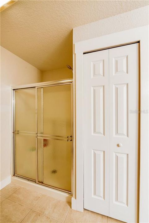 Linen/storage closet & separate shower in master bath