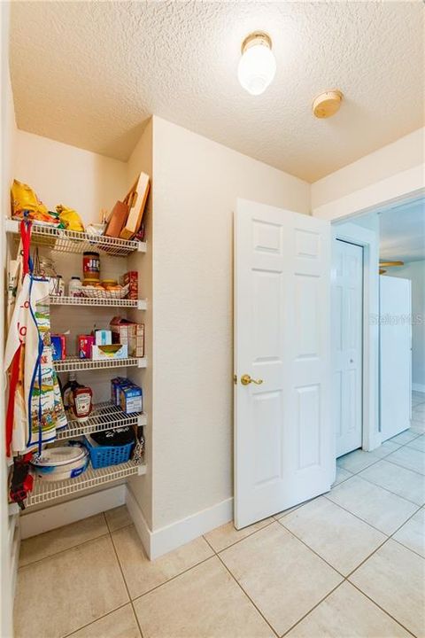 Pantry off kitchen leading to office & laundry room