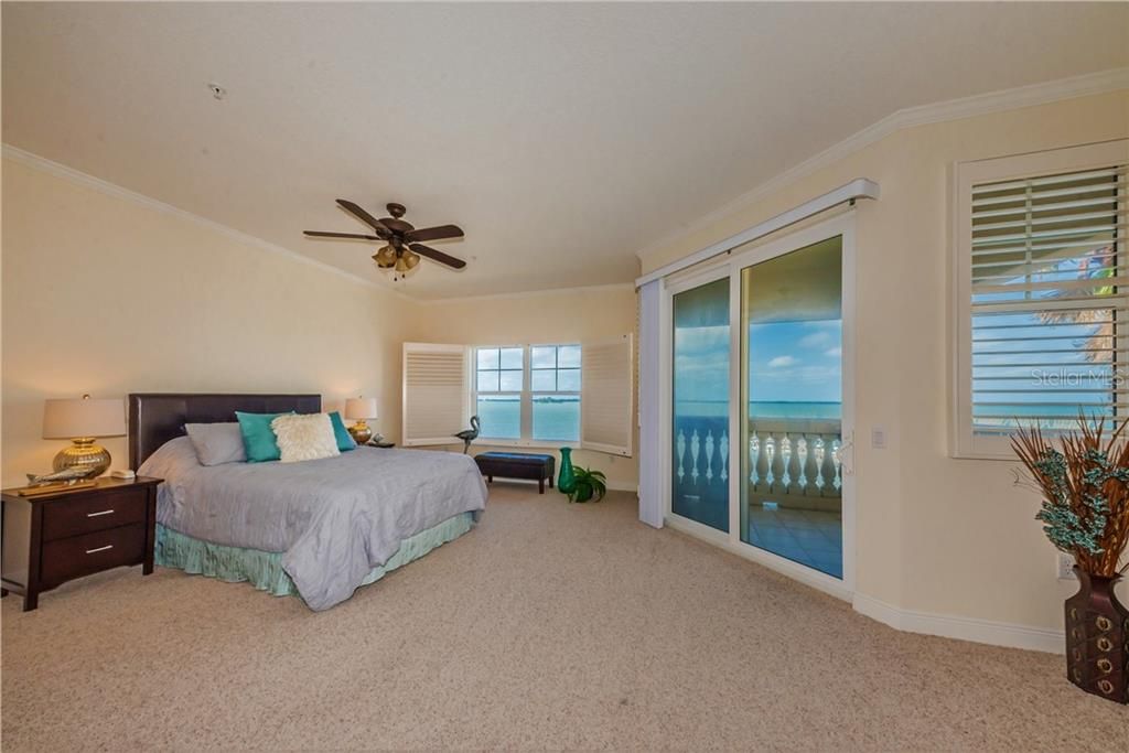 Master bedroom with private balcony on third floor