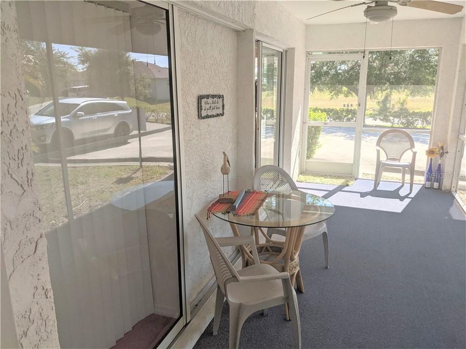 It is a quite wide lanai, with sliding doors to the master suite and the living room. The screened door give access to the front of the building and the car ports
