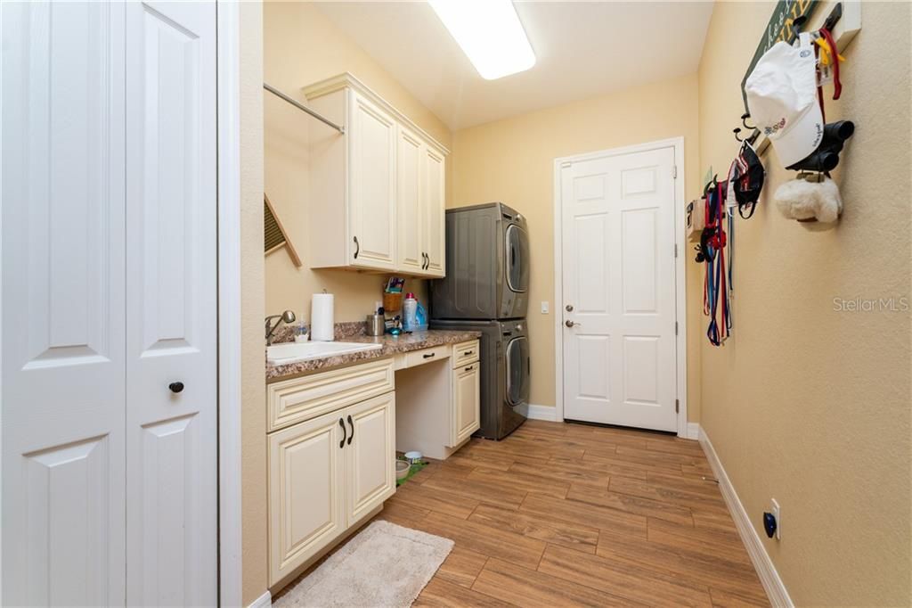 Adjacent to the kitchen is the large indoor laundry room.