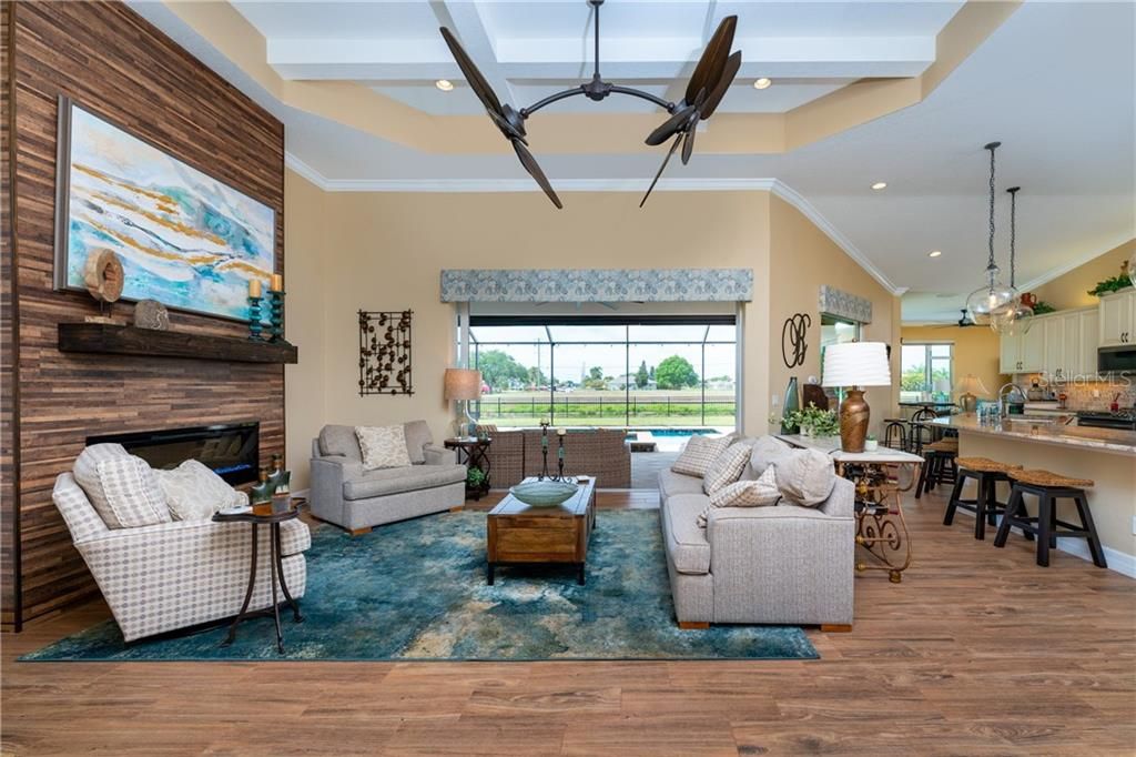 One of the two living areas offers a cozy fireplace to take the chill off of those Winter nights.  Expansive sliders open to the spectacular lanai, home to the heated saltwater pool/spa.