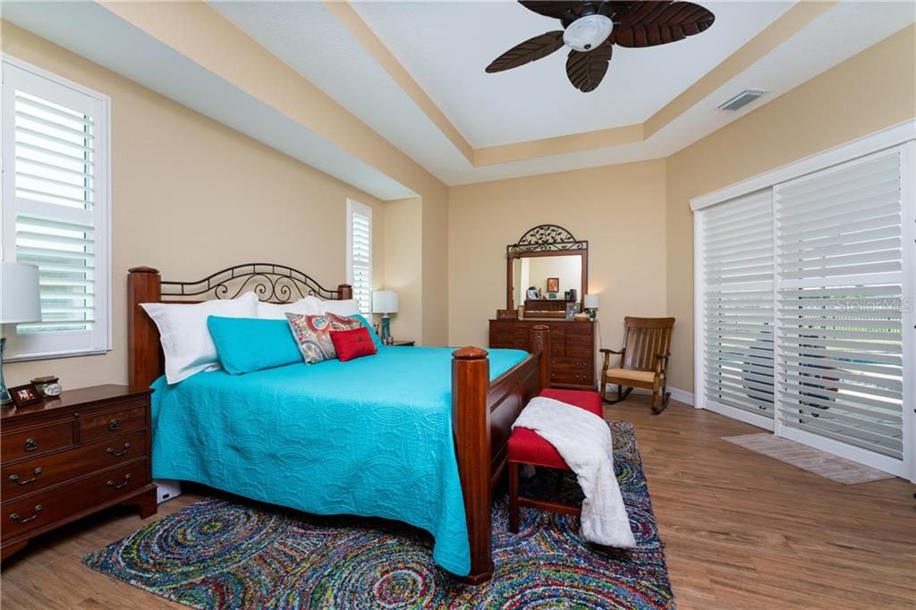 The sumptuous Master bedroom is a welcome respite after a fun-filled day at the beach.  Sliding doors lead to the heated (saltwater) pool/spa.