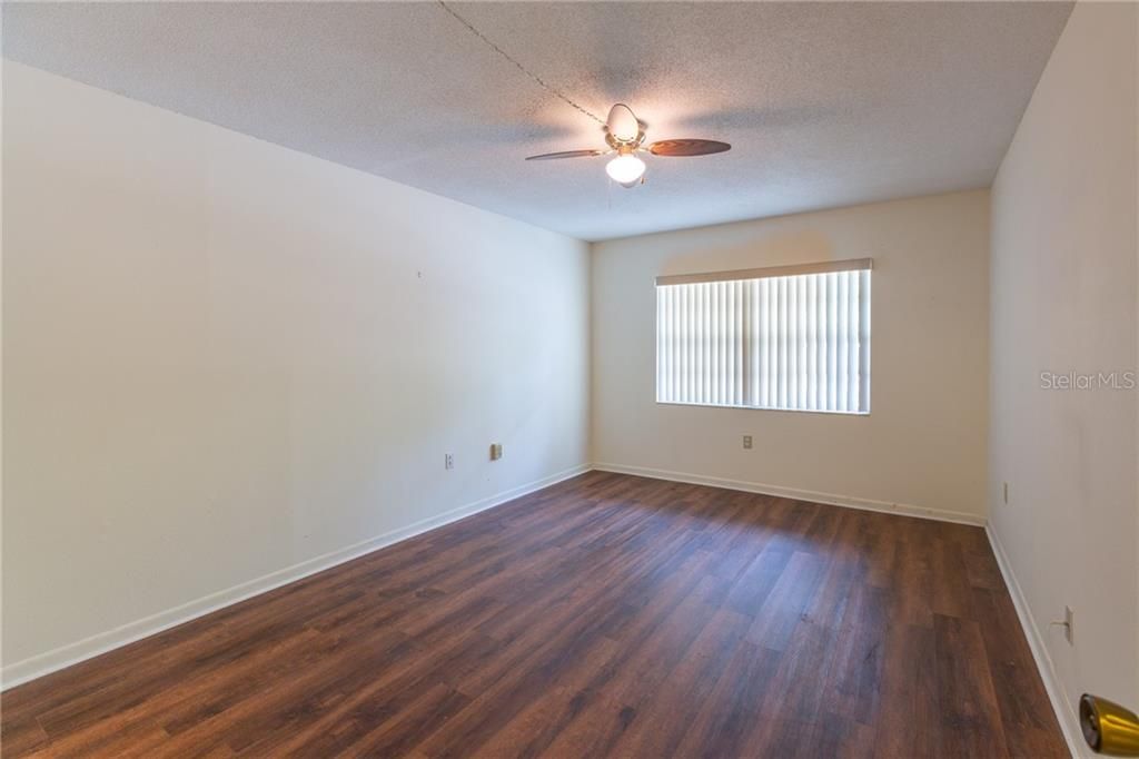 This is the 3rd bedroom that is split from the master and the 2nd bedroom and it is located at the front of the unit.  This bedroom also has a walk-in closet.