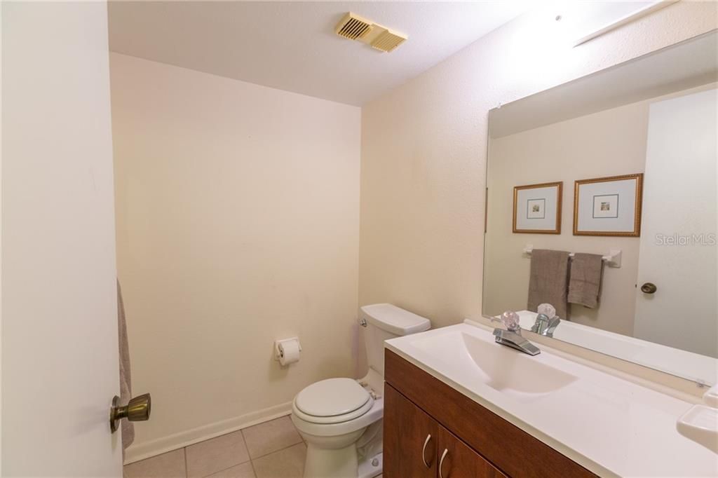 This is the remodeled half bath located off the hallway across from the 3rd bedroom.