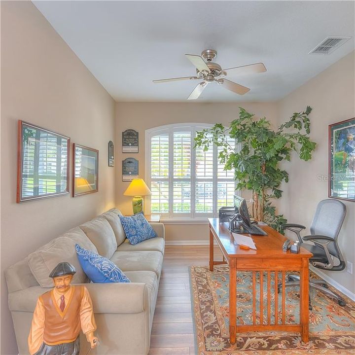 The living room situated at the front of the home has Plantation Shutters!  ALL OF THE FURNISHINGS ARE FOR SALE!