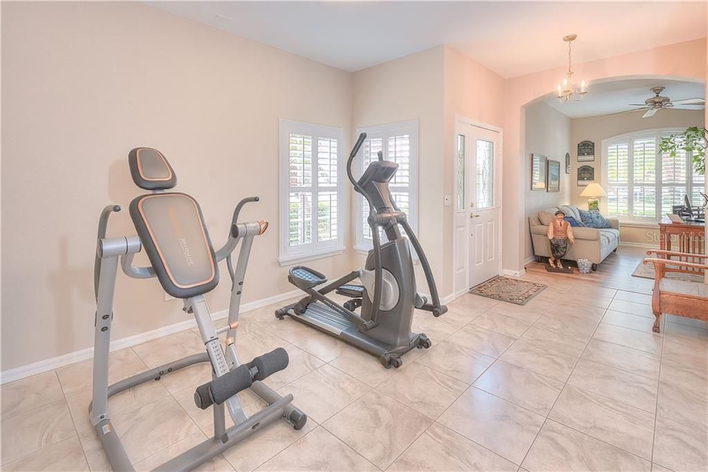 New tile floors grace the main living areas - the Seller is currently using the dining space for his home gym.