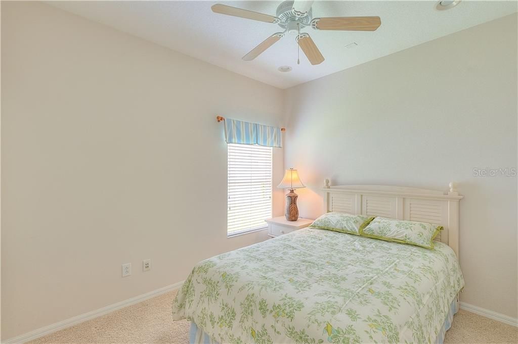 Bedroom #3 hosts newer carpet & a ceiling fan...