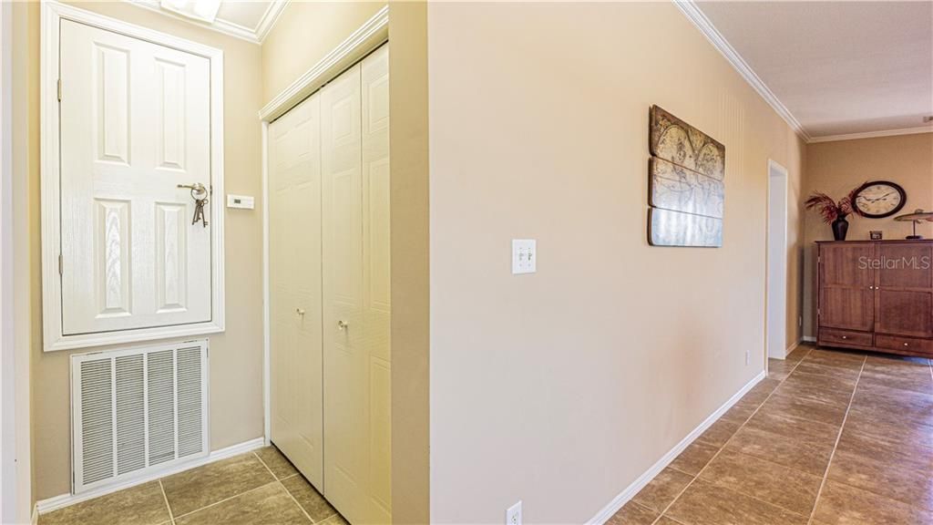 AC unit to the left. Laundry area to the right. Located between Living area and kitchen.
