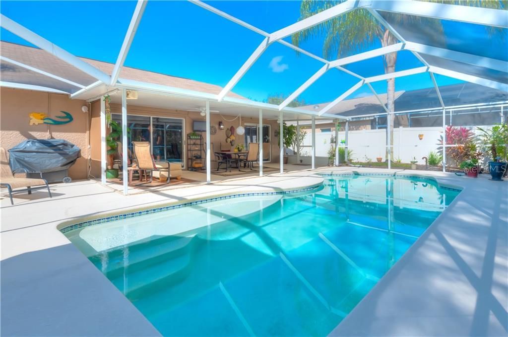 Relax in the privacy of your Heated Saltwater Pool within a 31' x 41' newly screened lanai! New PVC fence ensures privacy.