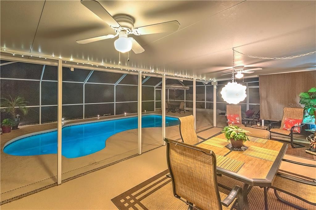 The heated Saltwater pool features tropical light...