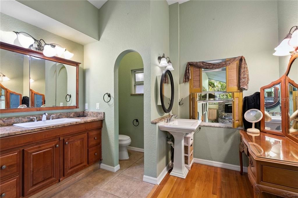 The pedestal sink in the Master Bath offers great views of the pool and spa