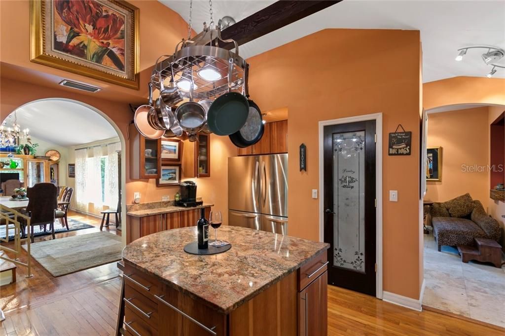 The wrap-around foyer leads into the formal dining room and gourmet kitchen