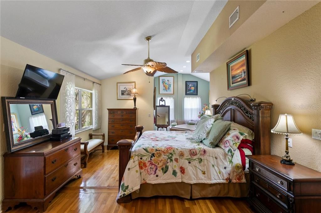 You'll find hardwood floors and vaulted ceilings in your Master Suite