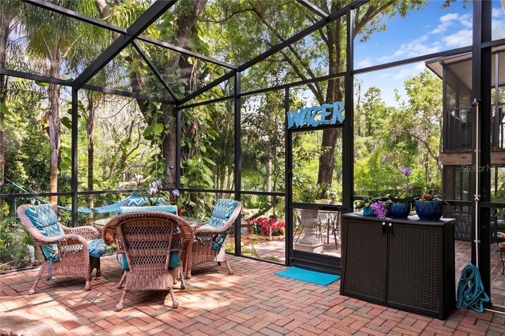 The screened lanai leads to another outdoor patio area