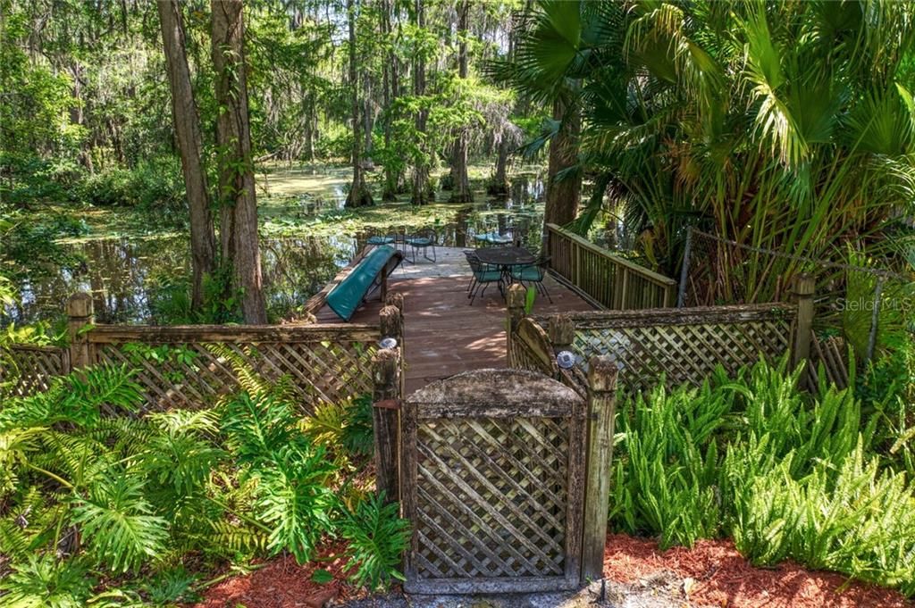 The rustic wooden gate leads to spectacular old world Florida views of the Hillsborough River