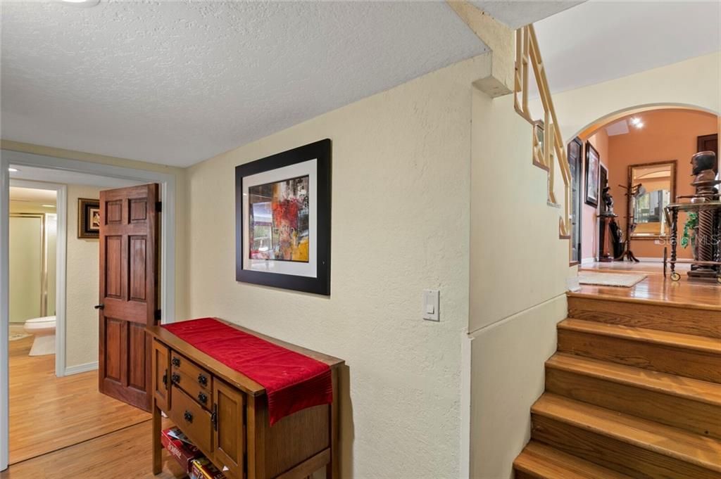 Head down the stairs from the Master Suite to find 3 more bedrooms and 2 full baths