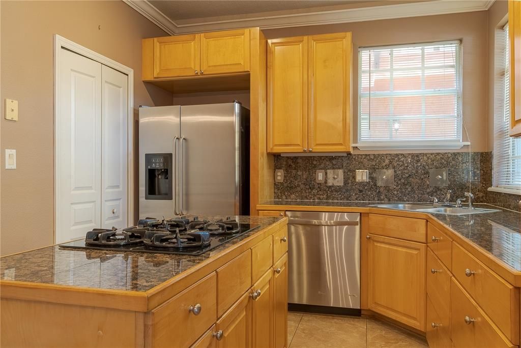 Stainless steel appliances, Laundry room next to fridge