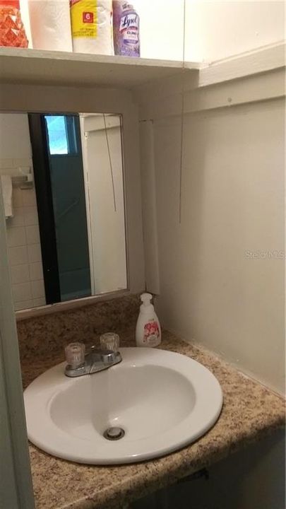 bathroom sink with medicine chest