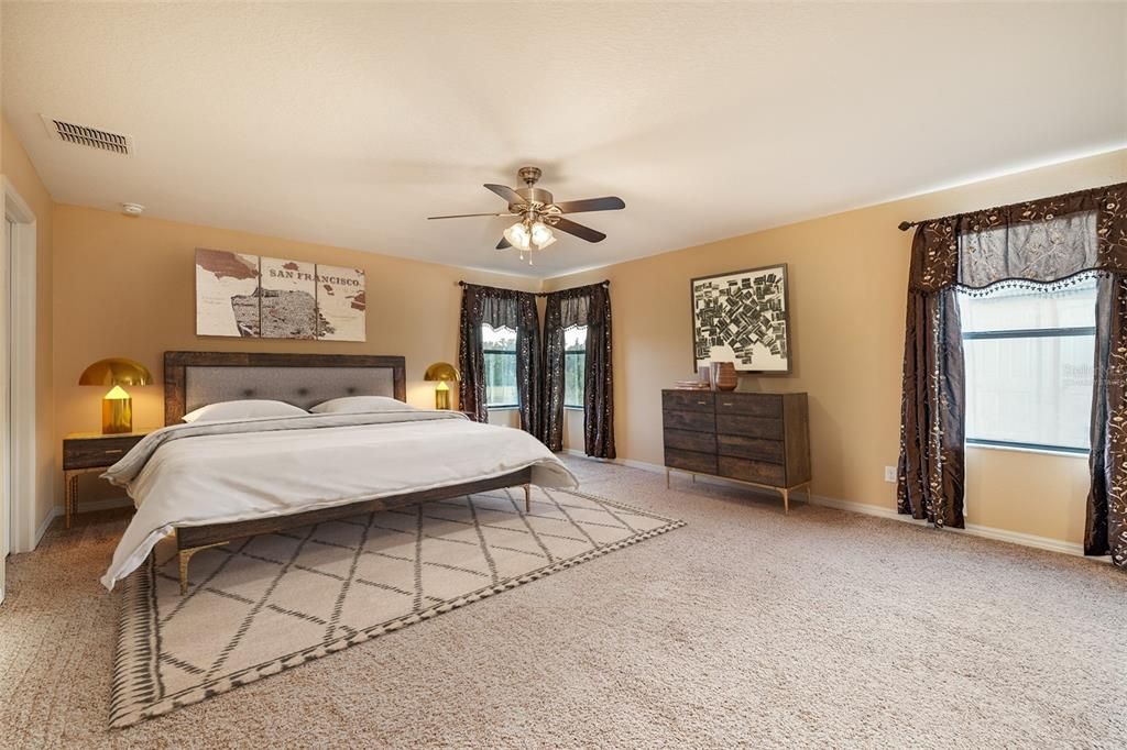 Virtually staged:  This upstairs Owner's Bedroom is light, bright and spacious!