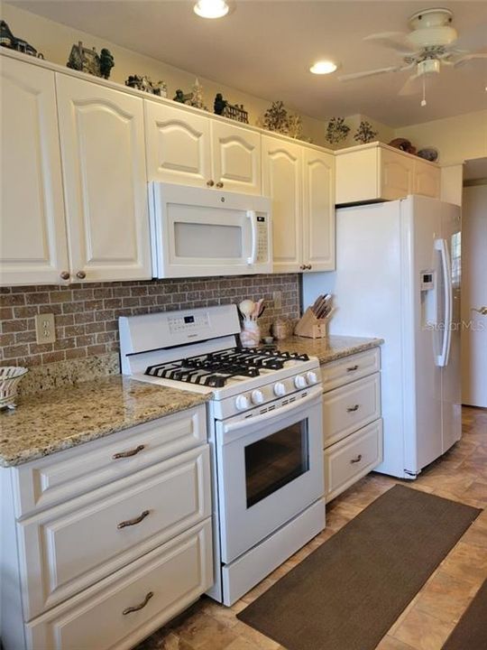 Kitchen - wooden cabinets and newer appliances.