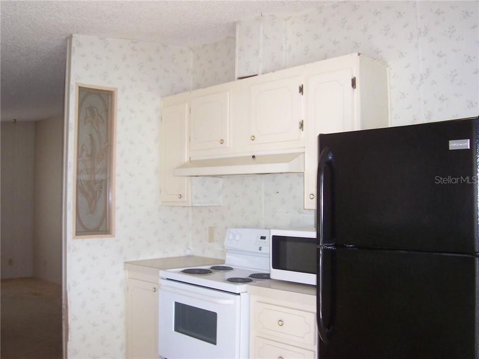 Nice cabinets - refrigerator and stove stay with home