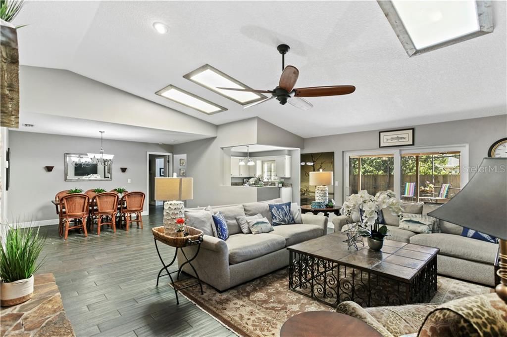 Great room overlooks the pool and patio through 8' sliders (2018).