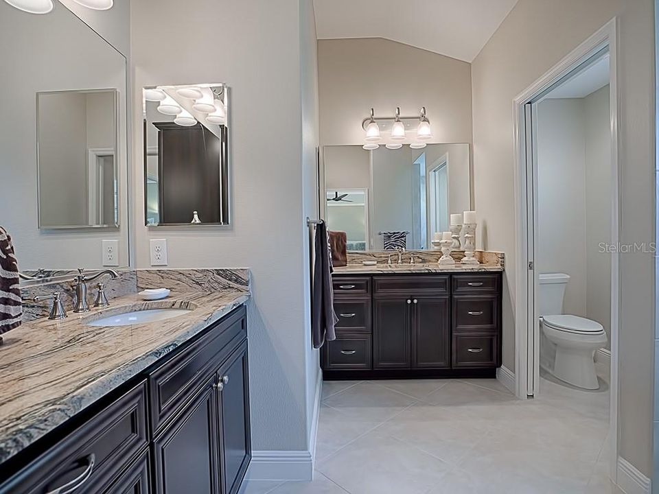 GRANITE COUNTER TOPS, HIS AND HERS SINKS, SEPARATE TOILET ROOM AND ROMAN SHOWER!