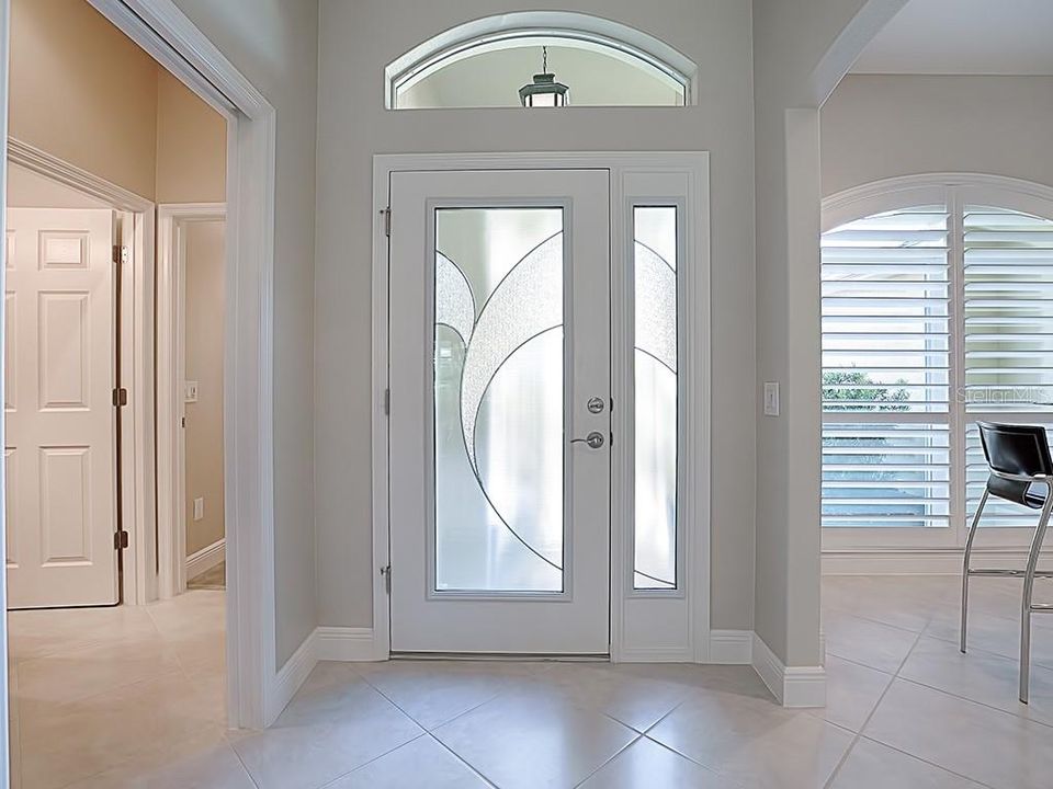 FOYER WITH CUSTOM GLASS DESIGN DOOR AND SIDELITE WITH TRANSOM!