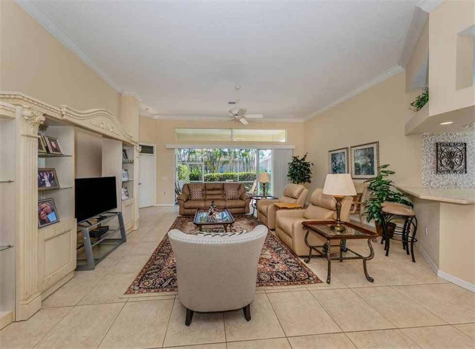 Large sliding glass doors lead to the screened, covered lanai.  Breakfast bar to your right.